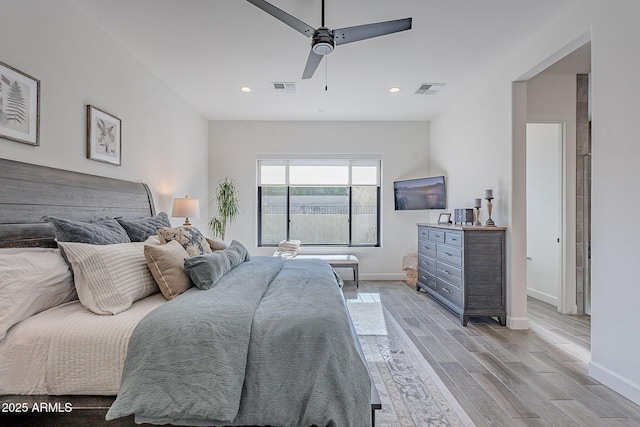 bedroom with light wood-type flooring and ceiling fan