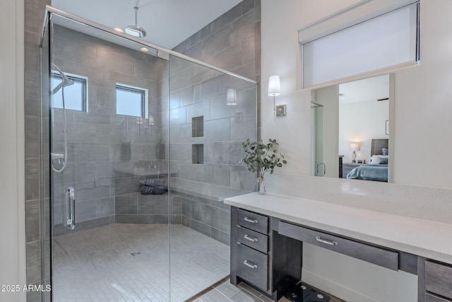 bathroom with an enclosed shower and vanity