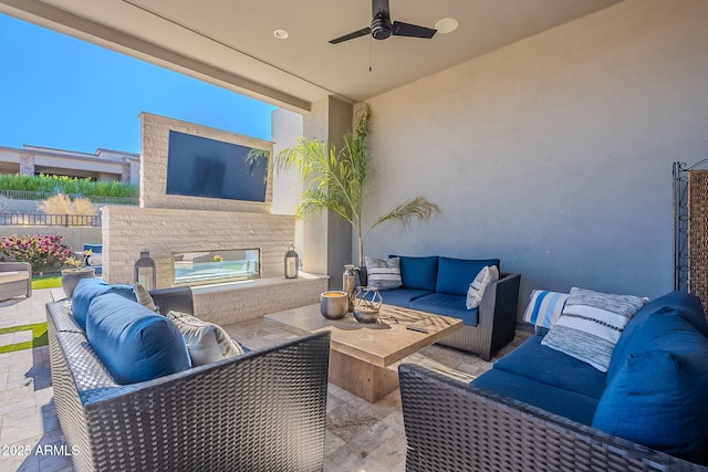 view of patio with an outdoor hangout area and ceiling fan