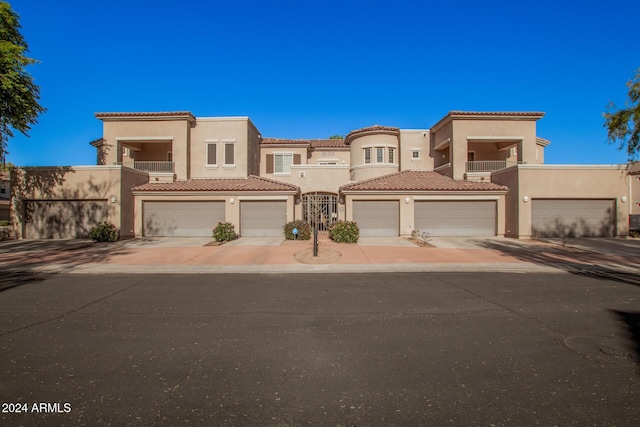 mediterranean / spanish house featuring a garage