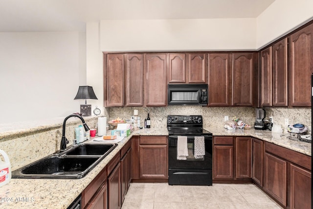 kitchen with backsplash, black appliances, sink, light tile patterned flooring, and light stone counters