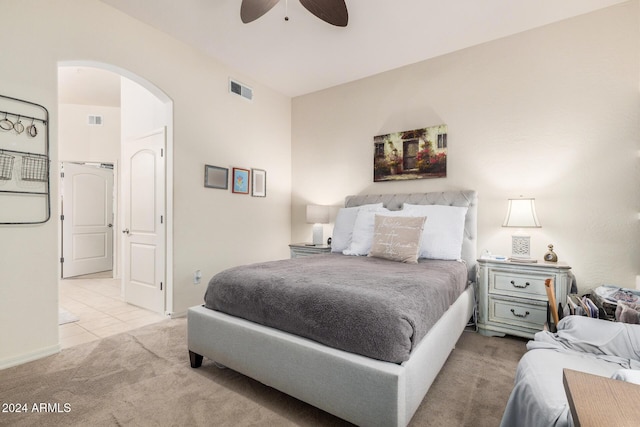 bedroom featuring light carpet and ceiling fan