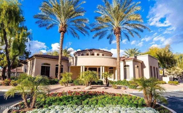 mediterranean / spanish house with a balcony