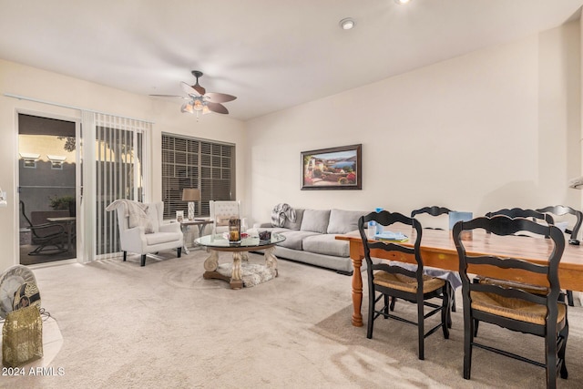 living room featuring carpet flooring and ceiling fan