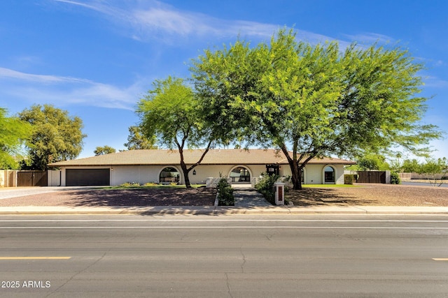 5112 E Cholla St, Scottsdale, AZ 85254 - single story home with an attached garage, concrete driveway, and fence