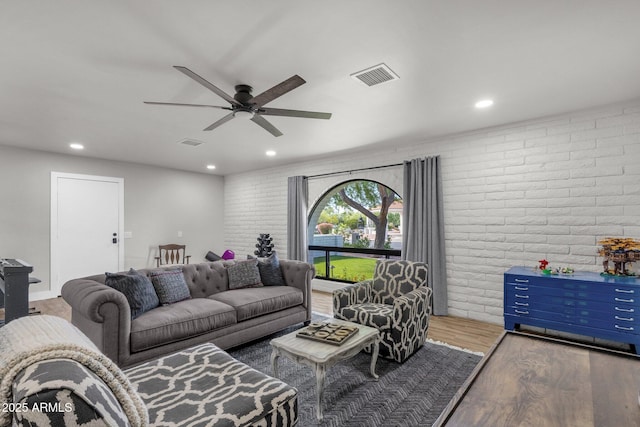 5112 E Cholla St, Scottsdale, AZ 85254 - living area with brick wall, wood finished floors, ceiling fan, and recessed lighting
