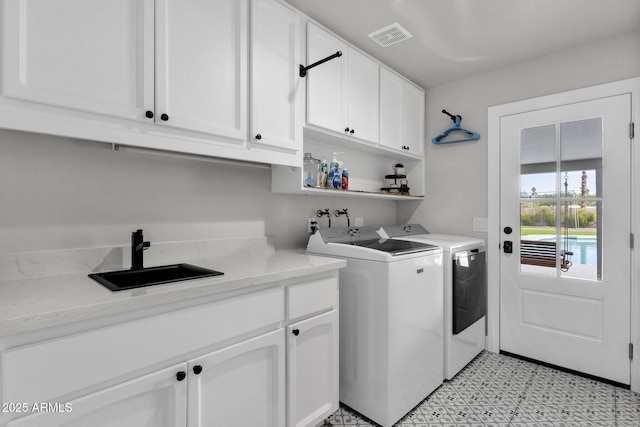 5112 E Cholla St, Scottsdale, AZ 85254 - laundry area with cabinet space, washer and clothes dryer, and light floors