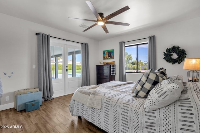 5112 E Cholla St, Scottsdale, AZ 85254 - bedroom with wood finished floors, ceiling fan, and access to outside