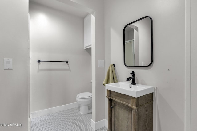 5112 E Cholla St, Scottsdale, AZ 85254 - bathroom with toilet, baseboards, vanity, and tile patterned flooring