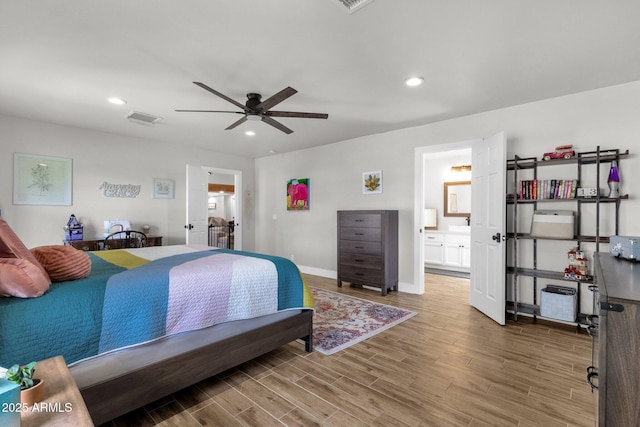 5112 E Cholla St, Scottsdale, AZ 85254 - bedroom with wood finished floors, recessed lighting, baseboards, ceiling fan, and connected bathroom