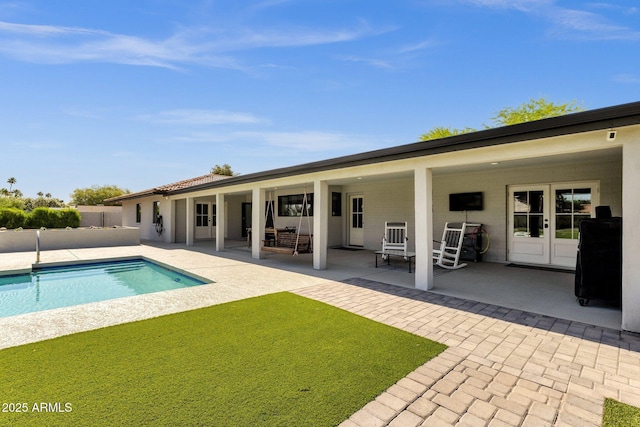 5112 E Cholla St, Scottsdale, AZ 85254 - rear view of property with a patio, an outdoor pool, french doors, stucco siding, and fence