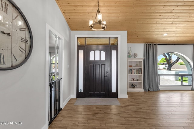 5112 E Cholla St, Scottsdale, AZ 85254 - foyer featuring wooden ceiling, a chandelier, wood finished floors, and baseboards