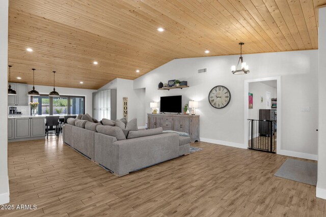 5112 E Cholla St, Scottsdale, AZ 85254 - living area featuring wood ceiling, lofted ceiling, light wood-type flooring, a chandelier, and recessed lighting