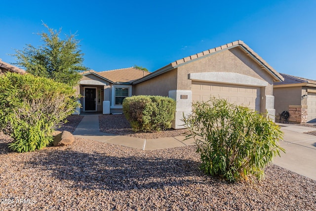 single story home with a garage