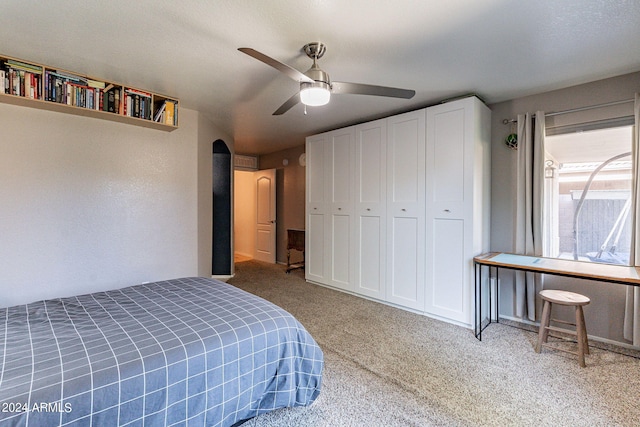 bedroom featuring carpet flooring, a closet, and ceiling fan