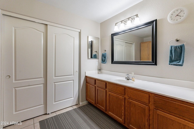 bathroom with tile patterned floors and vanity