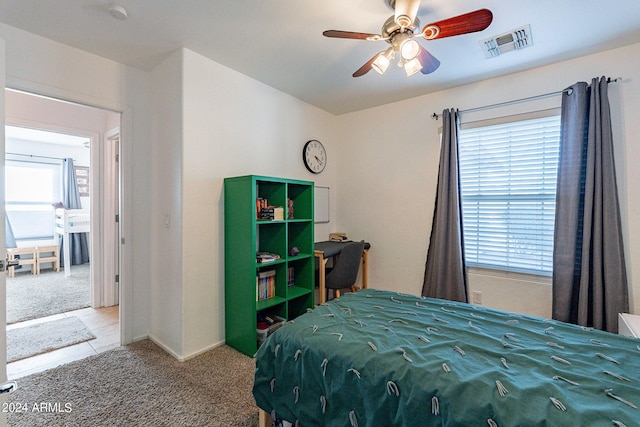 carpeted bedroom featuring ceiling fan