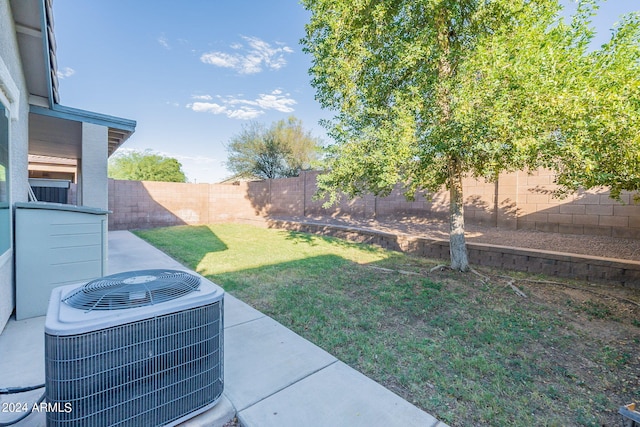 view of yard with central AC