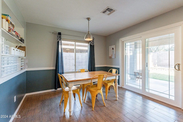 dining space featuring hardwood / wood-style floors and plenty of natural light