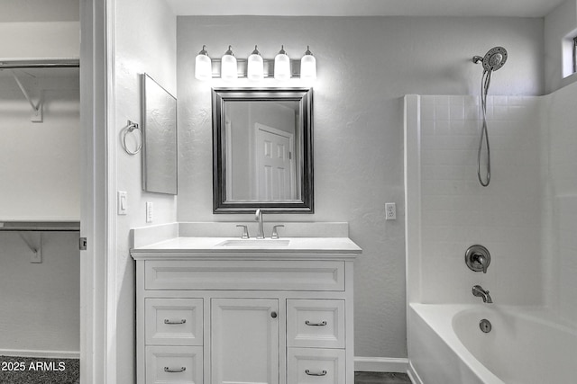 bathroom featuring vanity and shower / bathtub combination