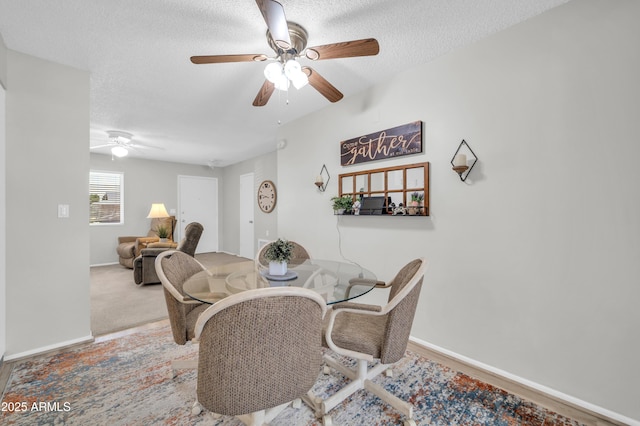 10873 W Clair Dr, Sun City, AZ 85351 - dining room featuring a ceiling fan and a textured ceiling