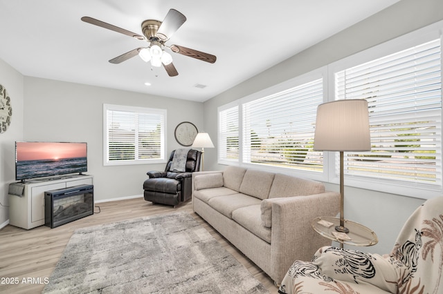 10873 W Clair Dr, Sun City, AZ 85351 - living area with wood finished floors and a ceiling fan