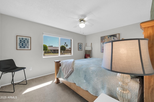 10873 W Clair Dr, Sun City, AZ 85351 - carpeted bedroom featuring baseboards and ceiling fan