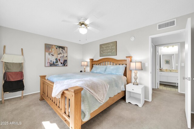 10873 W Clair Dr, Sun City, AZ 85351 - bedroom with light carpet and ceiling fan