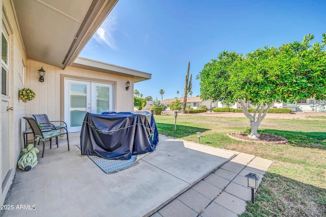 10873 W Clair Dr, Sun City, AZ 85351 - view of patio / terrace with french doors and grilling area