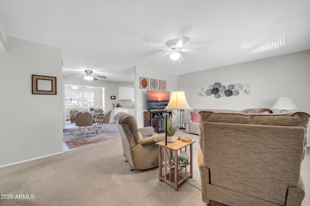 10873 W Clair Dr, Sun City, AZ 85351 - living area featuring ceiling fan, light carpet, and a textured ceiling