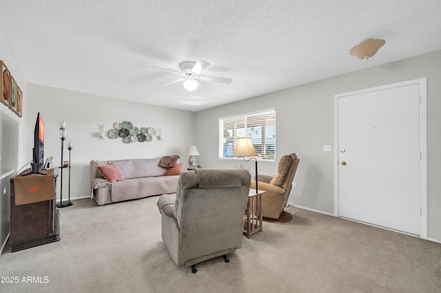 10873 W Clair Dr, Sun City, AZ 85351 - carpeted living room with ceiling fan and a textured ceiling