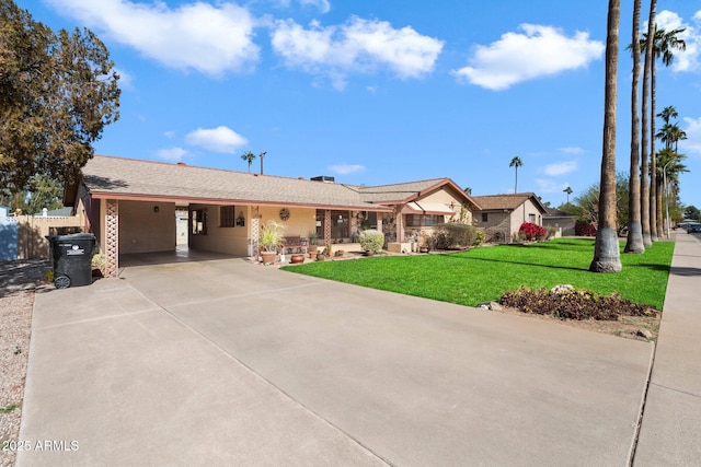 ranch-style home with a carport and a front lawn