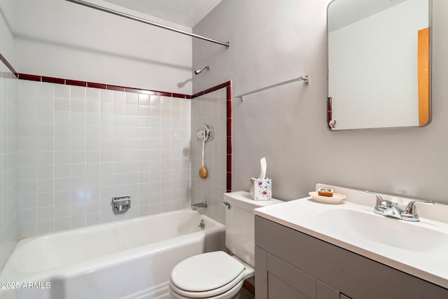 full bathroom with vanity, toilet, and tiled shower / bath combo