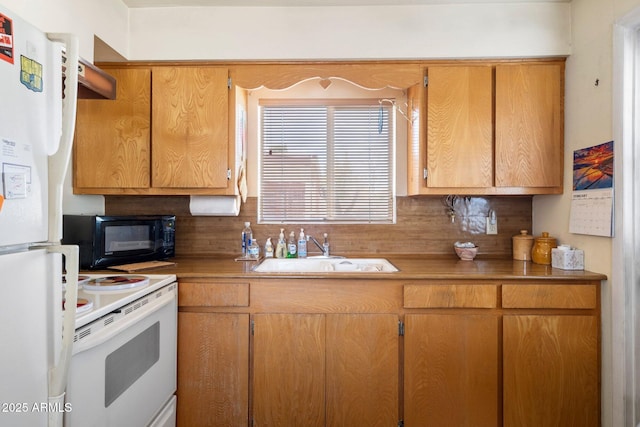 kitchen featuring tasteful backsplash, sink, and white appliances