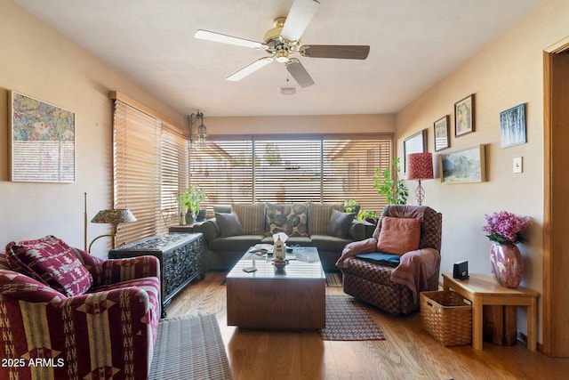 living room featuring hardwood / wood-style flooring and ceiling fan