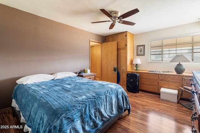 bedroom featuring ceiling fan and dark hardwood / wood-style floors