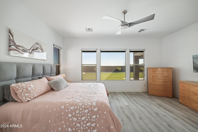 bedroom featuring light hardwood / wood-style floors and ceiling fan