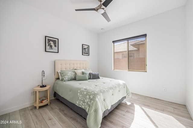 bedroom with wood-type flooring and ceiling fan