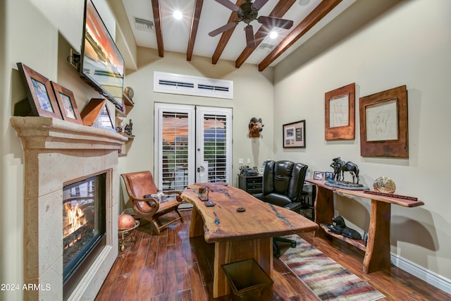 office space with a tile fireplace, french doors, and dark wood-type flooring