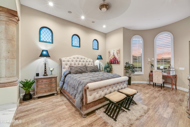 bedroom with light hardwood / wood-style floors and ceiling fan