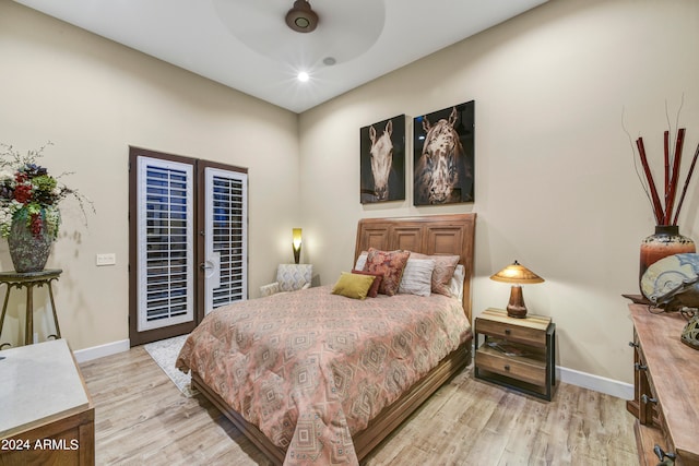 bedroom with french doors, light hardwood / wood-style floors, and ceiling fan