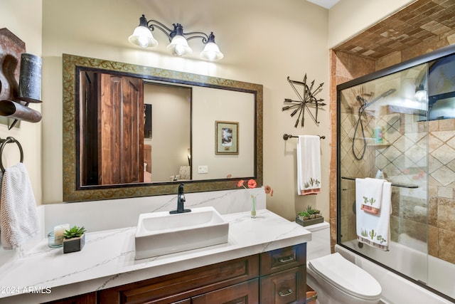 full bathroom featuring vanity, toilet, and enclosed tub / shower combo