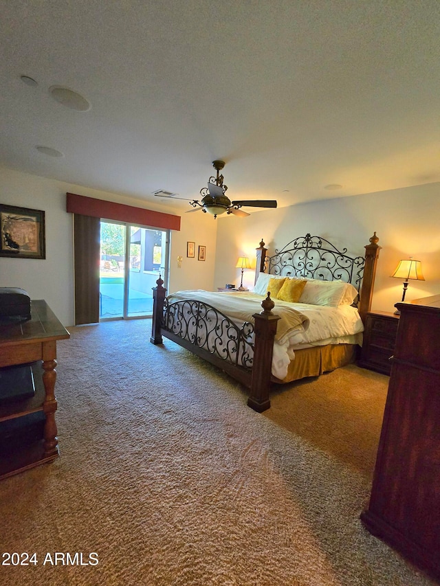 bedroom with access to outside, ceiling fan, carpet, and a textured ceiling