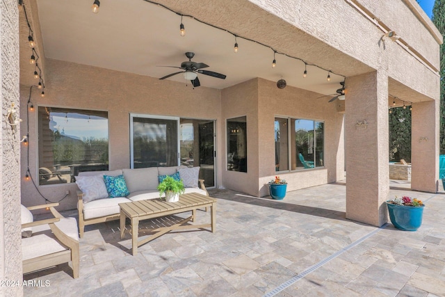 view of patio with outdoor lounge area and ceiling fan