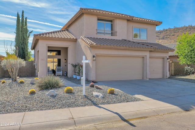 mediterranean / spanish-style house featuring a garage