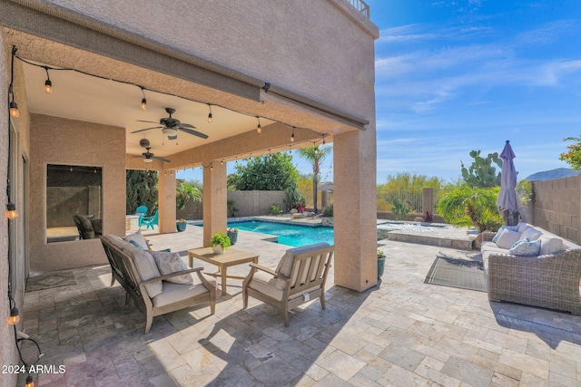 view of patio with a fenced in pool and ceiling fan