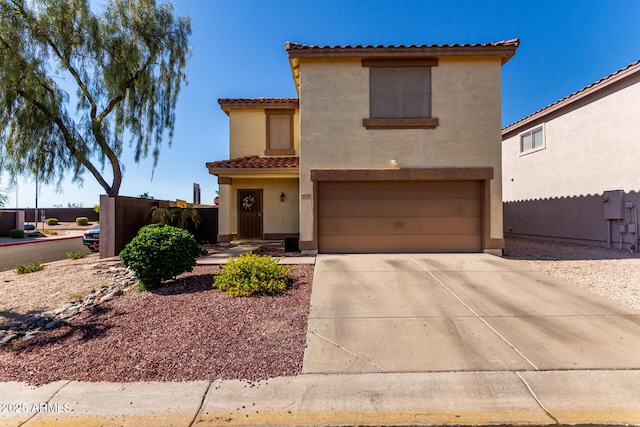 3235 S Bowman Rd, Apache Junction, AZ 85119 - mediterranean / spanish house featuring a garage, a tile roof, stucco siding, and concrete driveway