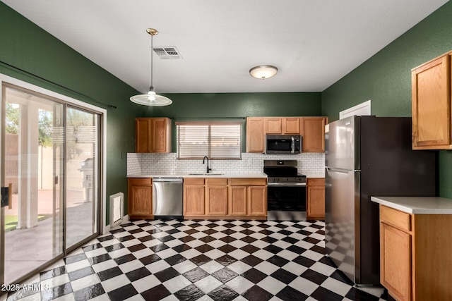 3235 S Bowman Rd, Apache Junction, AZ 85119 - kitchen with stainless steel appliances, a sink, light floors, light countertops, and decorative backsplash