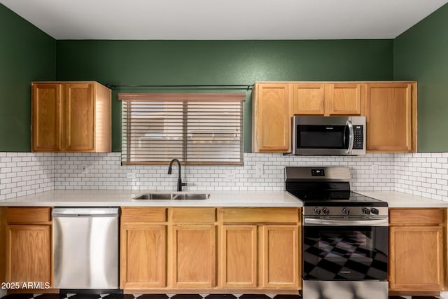 3235 S Bowman Rd, Apache Junction, AZ 85119 - kitchen featuring stainless steel appliances, a sink, light countertops, and decorative backsplash