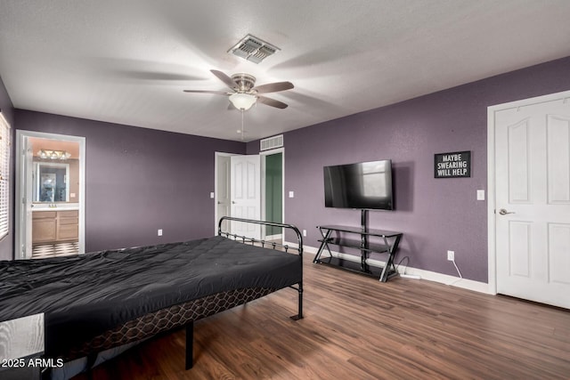 3235 S Bowman Rd, Apache Junction, AZ 85119 - bedroom featuring wood finished floors, baseboards, ceiling fan, ensuite bathroom, and a sink